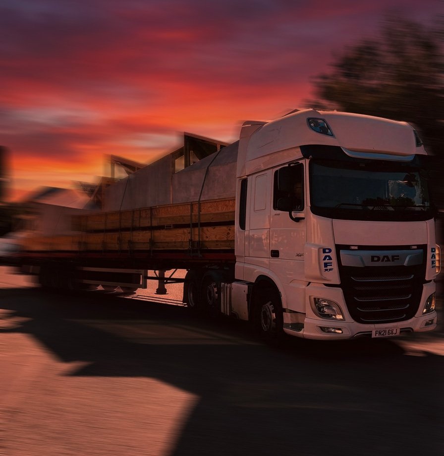 An HGV truck with a sunset in the background
